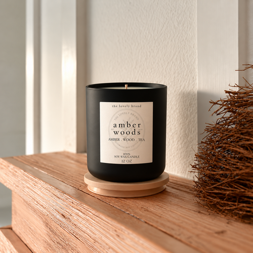 amber woods candle with 2x2 label