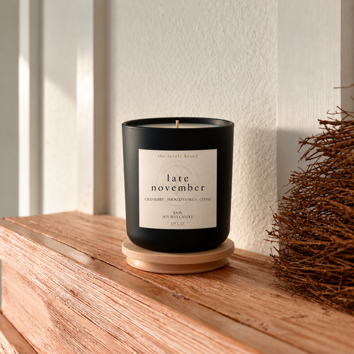 late november candle with 2x2 label